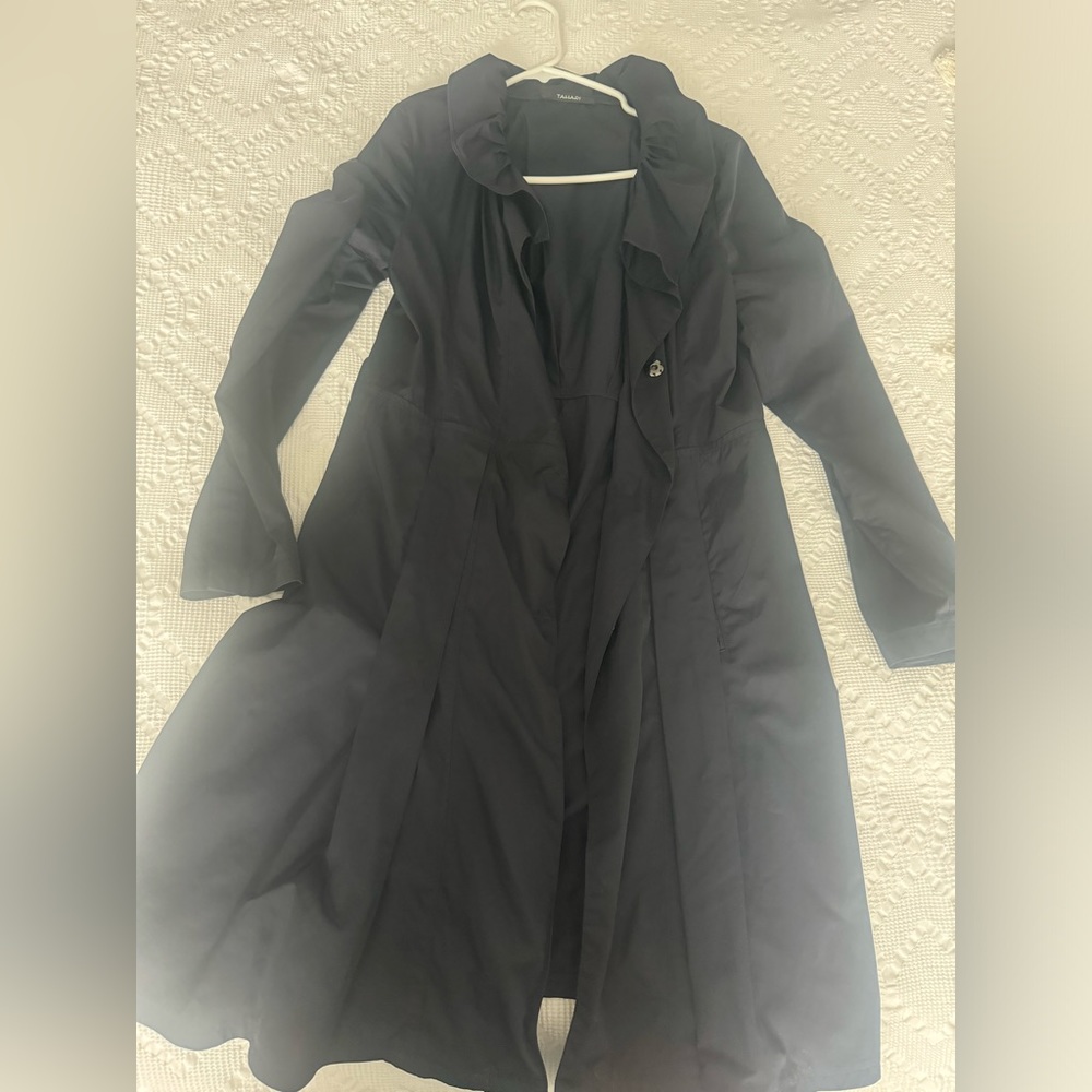 Rain/long coat flares at bottom